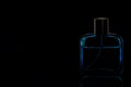 Blue Bottle Perfume for advertising in black background Royalty Free Stock Photo