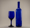 Blue bottle and single wine glass