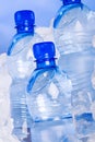 Blue bottles of water in ice Royalty Free Stock Photo