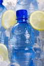 Blue bottles of water in ice Royalty Free Stock Photo