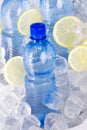 Blue bottles of water in ice Royalty Free Stock Photo