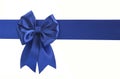 Blue bow on a blue ribbon on a white background Royalty Free Stock Photo