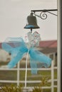 Blue bow hanging from a bell Royalty Free Stock Photo