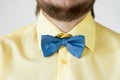 Blue bow-tie with yellow shirt.