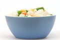 Blue bowl with cooked rice with mixed vegetable