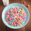 Blue bowl of fruit colored cereal rings on the background of table