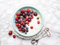 Blue bowl of hot oatmeal breakfast cereal with fresh berries, strawberries, cherries and blueberries from above Royalty Free Stock Photo