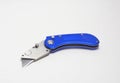 Blue box cutter or utility knife with blade open Royalty Free Stock Photo