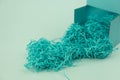 Blue box with blue shredded paper packing material Royalty Free Stock Photo