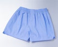 Blue boxer short over silver