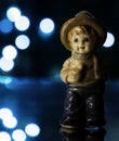 Blue Boy - Figurine with blue bokeh