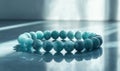 A blue bracelet with blue beads is laying on a table Royalty Free Stock Photo