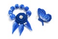 Blue bracelet and brooch in the form of a butterfly handmade on a white background Royalty Free Stock Photo