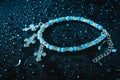 Blue bracelet with drops of water Royalty Free Stock Photo