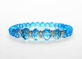 Blue bracelet isolated on white Royalty Free Stock Photo