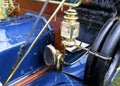 Detail of a blue brass era antique car Royalty Free Stock Photo