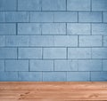 Blue brick background and wooden floor Royalty Free Stock Photo