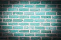Blue brick wall seamless pattern, fading spotlight background texture Royalty Free Stock Photo