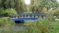 Blue bridge in Furst Puckler Park in Bad Muskau town, Germany