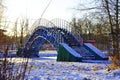 Blue bridge over an icy river Royalty Free Stock Photo