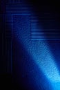 Blue bright diagonal ray of light crosses the background with a pattern Royalty Free Stock Photo