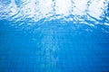 Blue and bright ripple water and surface in swimming pool. Royalty Free Stock Photo
