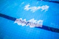 Blue and bright ripple water and surface in swimming pool. Royalty Free Stock Photo