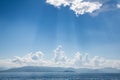 Blue bright sky background on the ocean with clouds and emotional mood for dreams, mourning, death concepts.