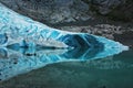 the blue Briksdal glasier with the reflection on the lake, Oban, Norway