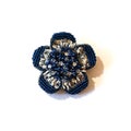 Blue brooch in the form of a flower from beads and sequins Royalty Free Stock Photo