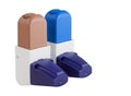 Blue and Brown Asthma Inhalers with caps