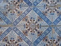Blue and brown ceramic tiles from facade of old houses in Lisbon Portugal. Portuguese traditional Azulejos decorative Royalty Free Stock Photo