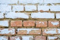 Blue peeling old brick wall with paint, background texture close up Royalty Free Stock Photo