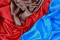 Blue and brown and red silk satin cloth of wavy folds texture ba Royalty Free Stock Photo