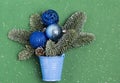 Blue bucket with a Christmas tree and Christmas toys. Preparing for the new year Royalty Free Stock Photo