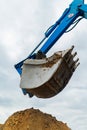 Blue bucket excavator close up Royalty Free Stock Photo