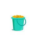 Blue bucket full of gold coins. Isolated on a white background Royalty Free Stock Photo