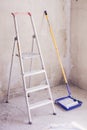 Blue bucket with paint, brush roller paint tray and ladder Royalty Free Stock Photo