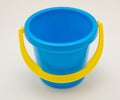 Blue bucket toy with yellow handle isolated on transparent background. Baby and kid activity for the beach. PNG Royalty Free Stock Photo