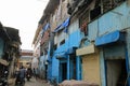 Blue buildings in a street in Dharavi