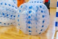 Blue bumper boll bubble balloons in the sports center. Equipment for team building sport game named bumper ball or Royalty Free Stock Photo