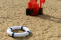 Blue buoy on sand with a blowing machine nearby Royalty Free Stock Photo