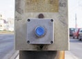 The blue button of inclusion of the traffic light for crossing of the street by pedestrians. Royalty Free Stock Photo