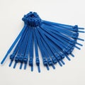 Blue cable ties bundle isolated on white background Royalty Free Stock Photo