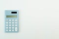 Blue calculator white background image close up. Royalty Free Stock Photo