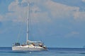 Blue calm sea clear sky with sailboat