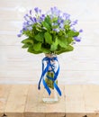 blue campanula bouquet on crystal glass