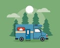 blue camper in forest