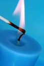 Blue candle with match