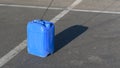 Blue canister on the pavement in sunny day